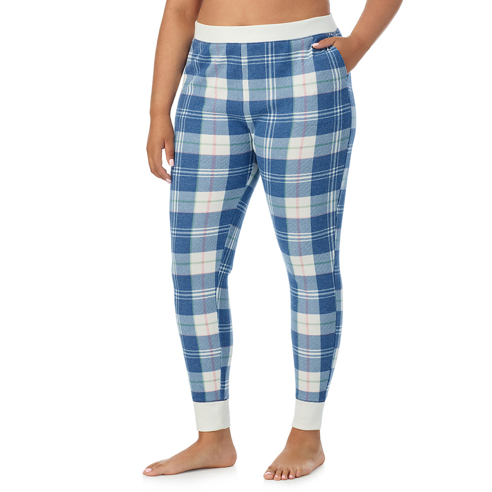 A Lady is wearing a Blue Plaid Cozy Stretch Thermal Legging PLUS