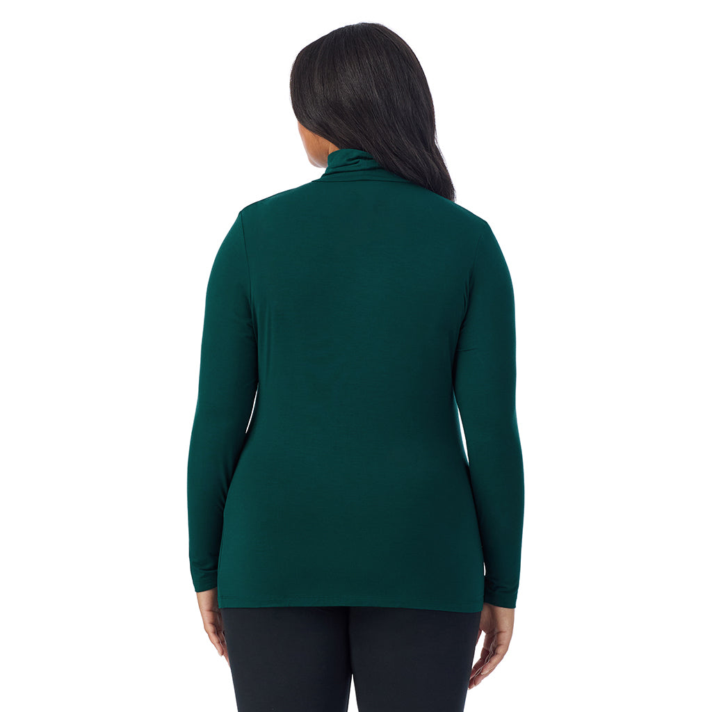 A lady wearing dark pine long sleeve turtleneck plus softwear with stretch top.