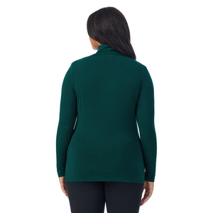 A lady wearing dark pine long sleeve turtleneck plus softwear with stretch top.