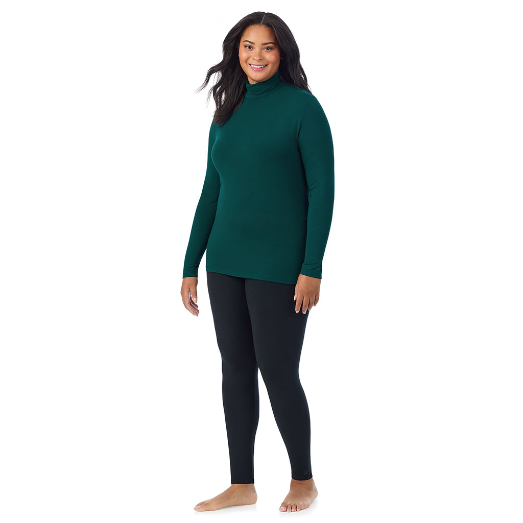 A lady wearing dark pine long sleeve turtleneck plus softwear with stretch top.