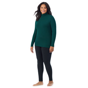 A lady wearing dark pine long sleeve turtleneck plus softwear with stretch top.