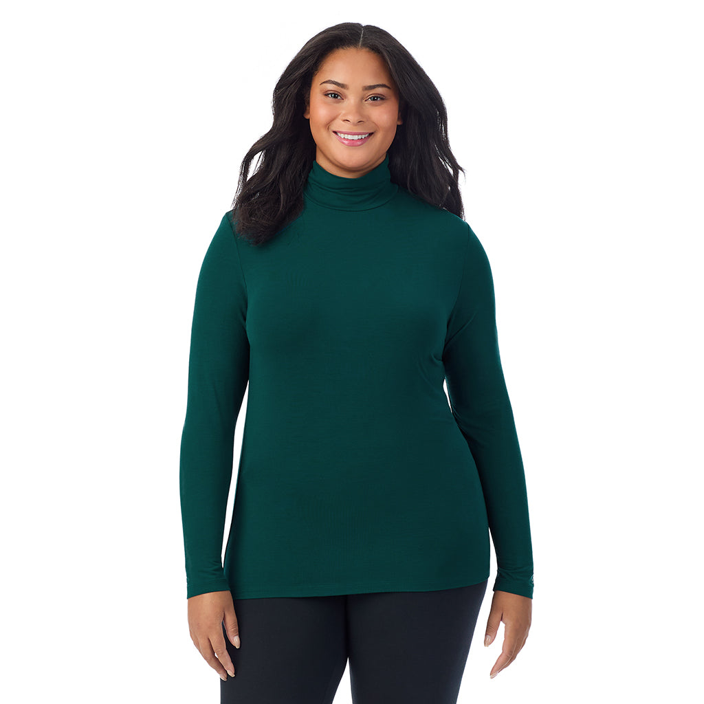 A lady wearing dark pine long sleeve turtleneck plus softwear with stretch top.