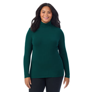 A lady wearing dark pine long sleeve turtleneck plus softwear with stretch top.