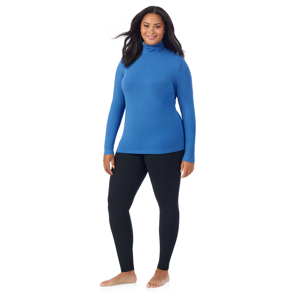 A lady wearing blue comet long sleeve turtleneck plus softwear with stretch top.