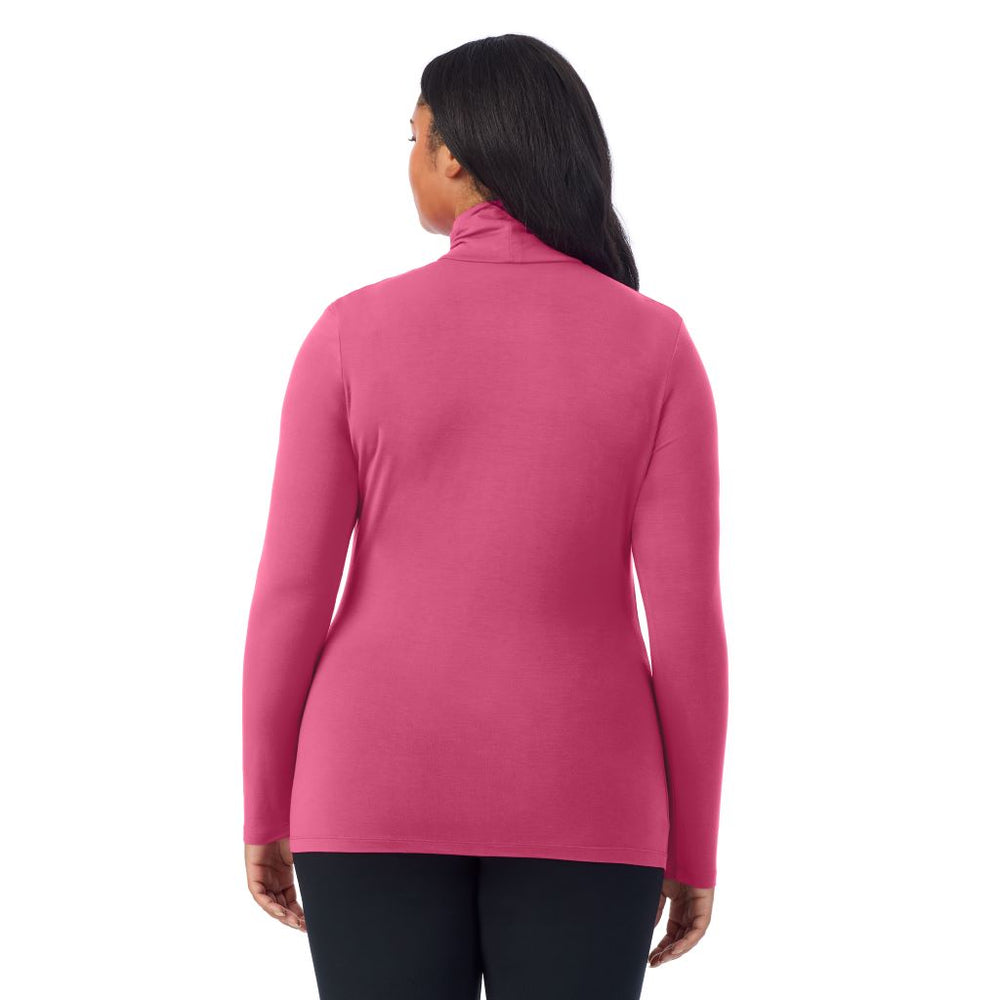 A lady wearing very berry long sleeve turtleneck plus softwear with stretch top.
