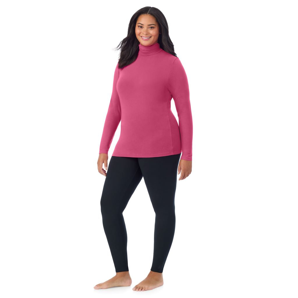 A lady wearing very berry long sleeve turtleneck plus softwear with stretch top.