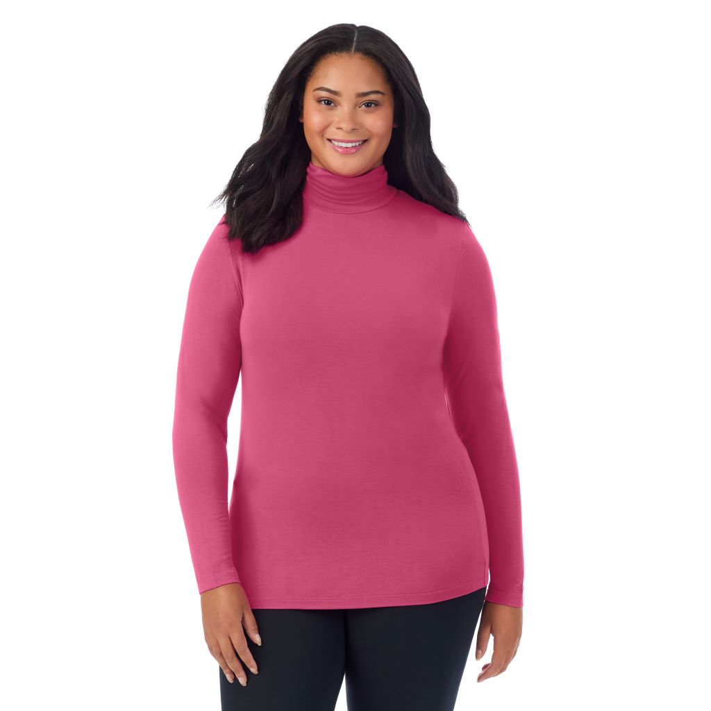A lady wearing very berry long sleeve turtleneck plus softwear with stretch top.
