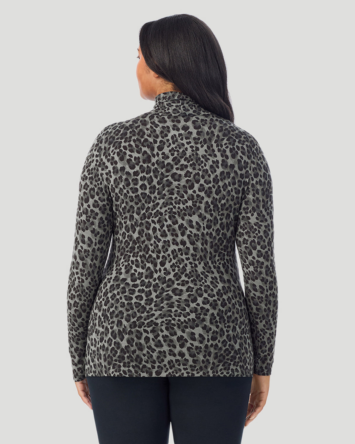 Charcoal Leopard; Model is wearing size 1X. She is 5'10", Bust 44", Waist 36", Hips 49". @ A plus size Lady wearing Charcoal Leopard Softwear With Stretch Long Sleeve Turtleneck PLUS in a back view pose