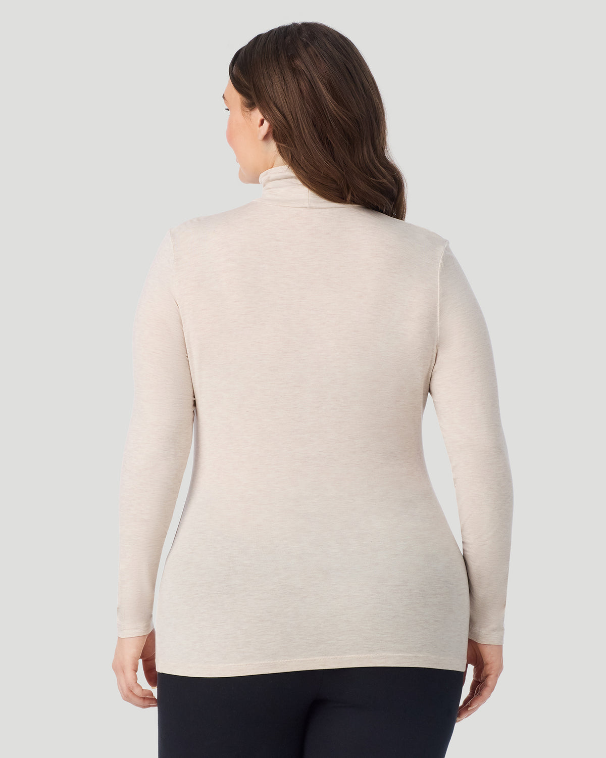 Oatmeal Heather; Model is wearing size 1X. She is 5'10", Bust 44", Waist 36", Hips 49". @ A plus size Lady wearing Oatmeal Heather Softwear With Stretch Long Sleeve Turtleneck PLUS in a back view pose