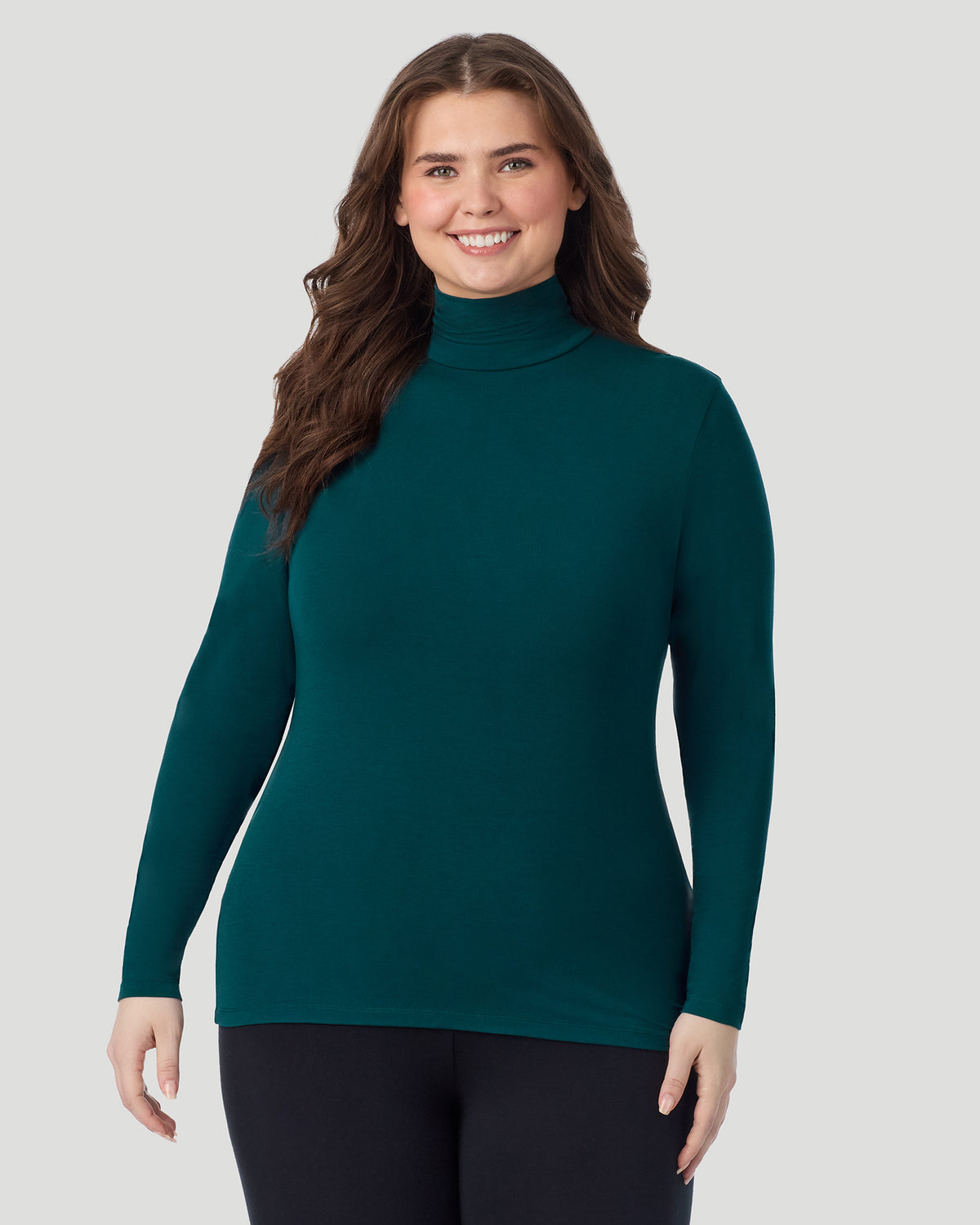  A plus size Lady wearing Deep Emerald Softwear With Stretch Long Sleeve Turtleneck PLUS in a front view pose