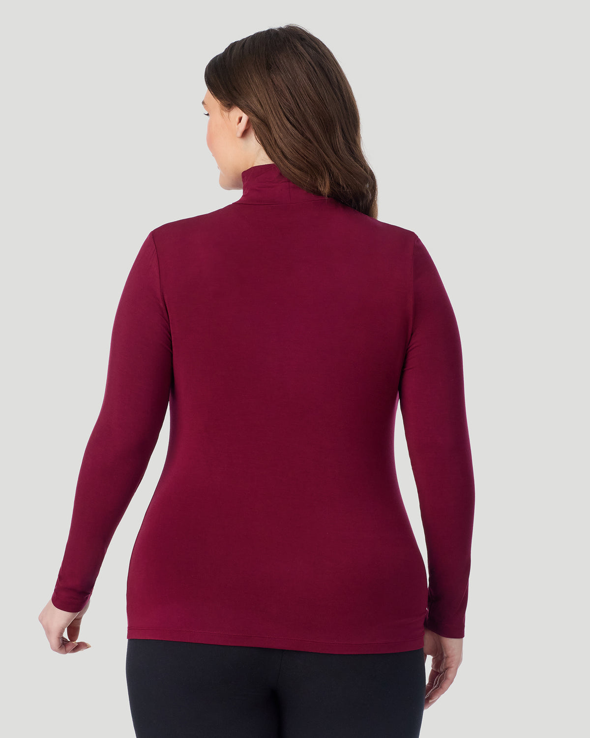  A plus size Lady wearing Bordeaux Softwear With Stretch Long Sleeve Turtleneck PLUS in a back view pose