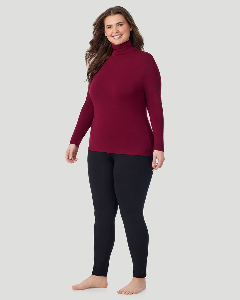  A plus size Lady wearing Bordeaux Softwear With Stretch Long Sleeve Turtleneck PLUS in a front view standing pose