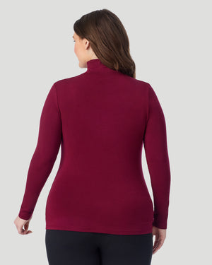  A plus size Lady wearing Bordeaux Softwear With Stretch Long Sleeve Turtleneck PLUS in a back view pose