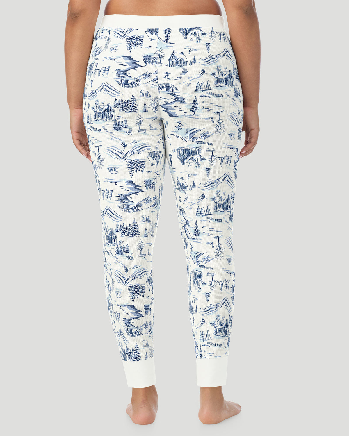 Blue Winter Toile; Model is wearing size 1X. She is 5'10", Bust 44", Waist 36", Hips 49". @ A plus size Lady wearing Blue Winter Toile Cozy Stretch Thermal Legging PLUS in a back view pose