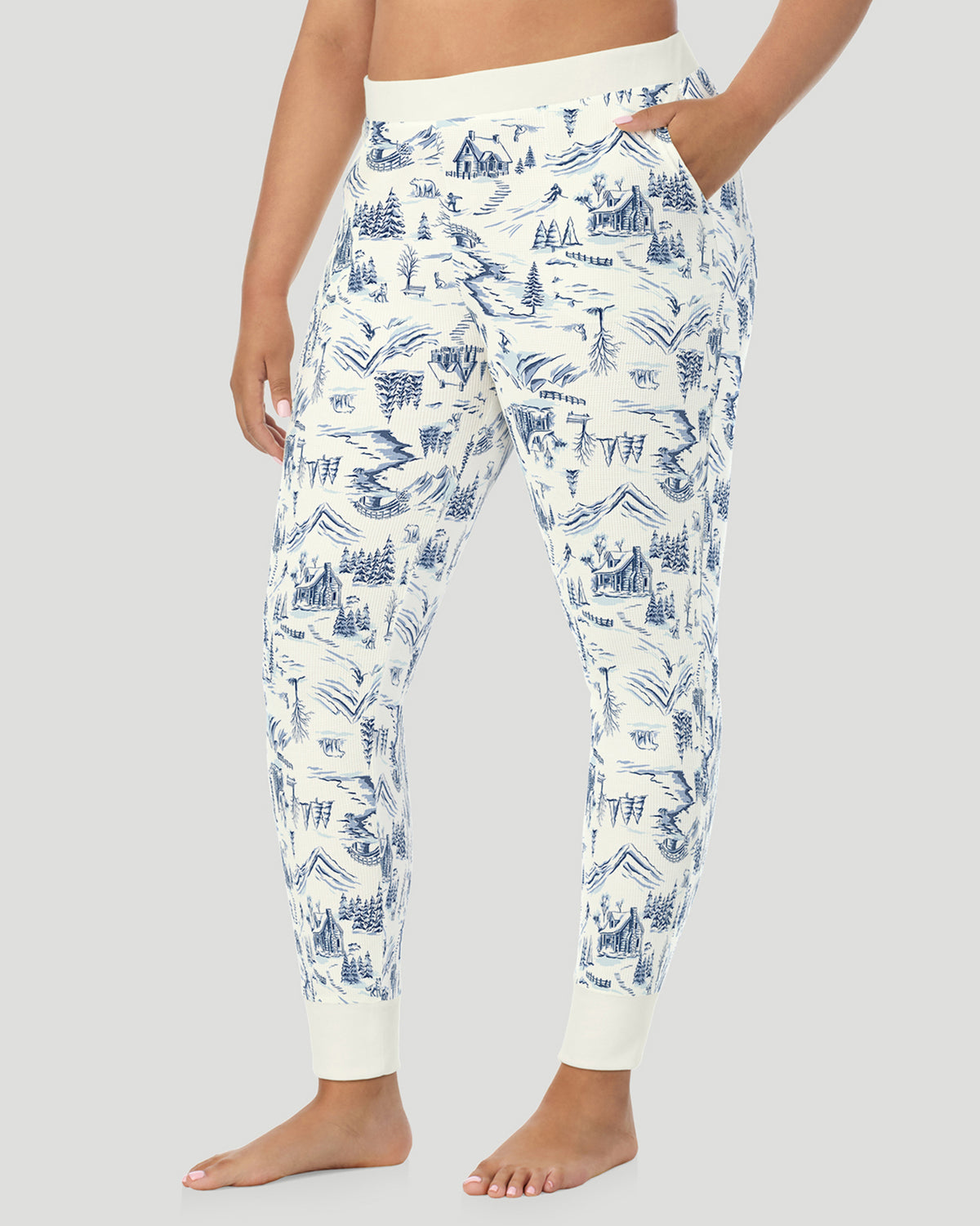 Blue Winter Toile; Model is wearing size 1X. She is 5'10", Bust 44", Waist 36", Hips 49". @ A plus size Lady wearing Blue Winter Toile Cozy Stretch Thermal Legging PLUS in a side view pose