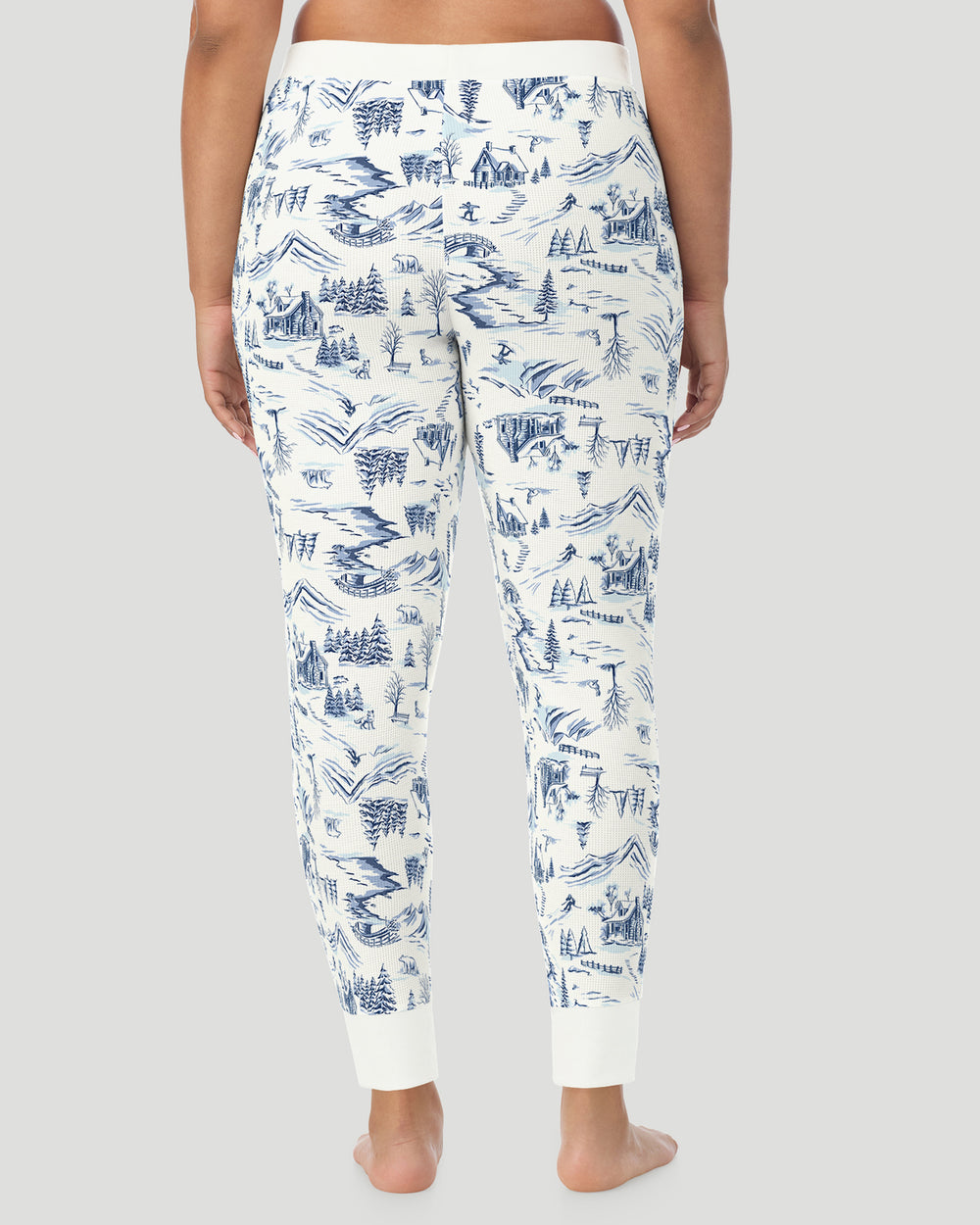 A plus size Lady wearing Blue Winter Toile Cozy Stretch Thermal Legging PLUS in a back view pose