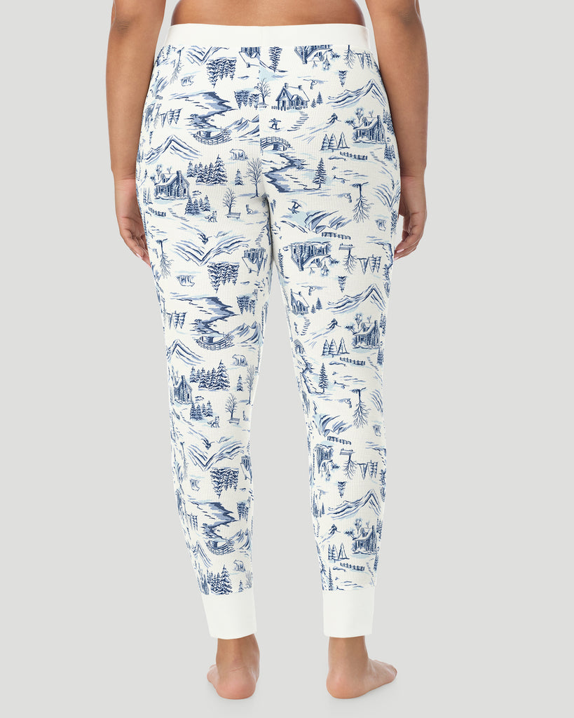  A plus size Lady wearing Blue Winter Toile Cozy Stretch Thermal Legging PLUS in a back view pose
