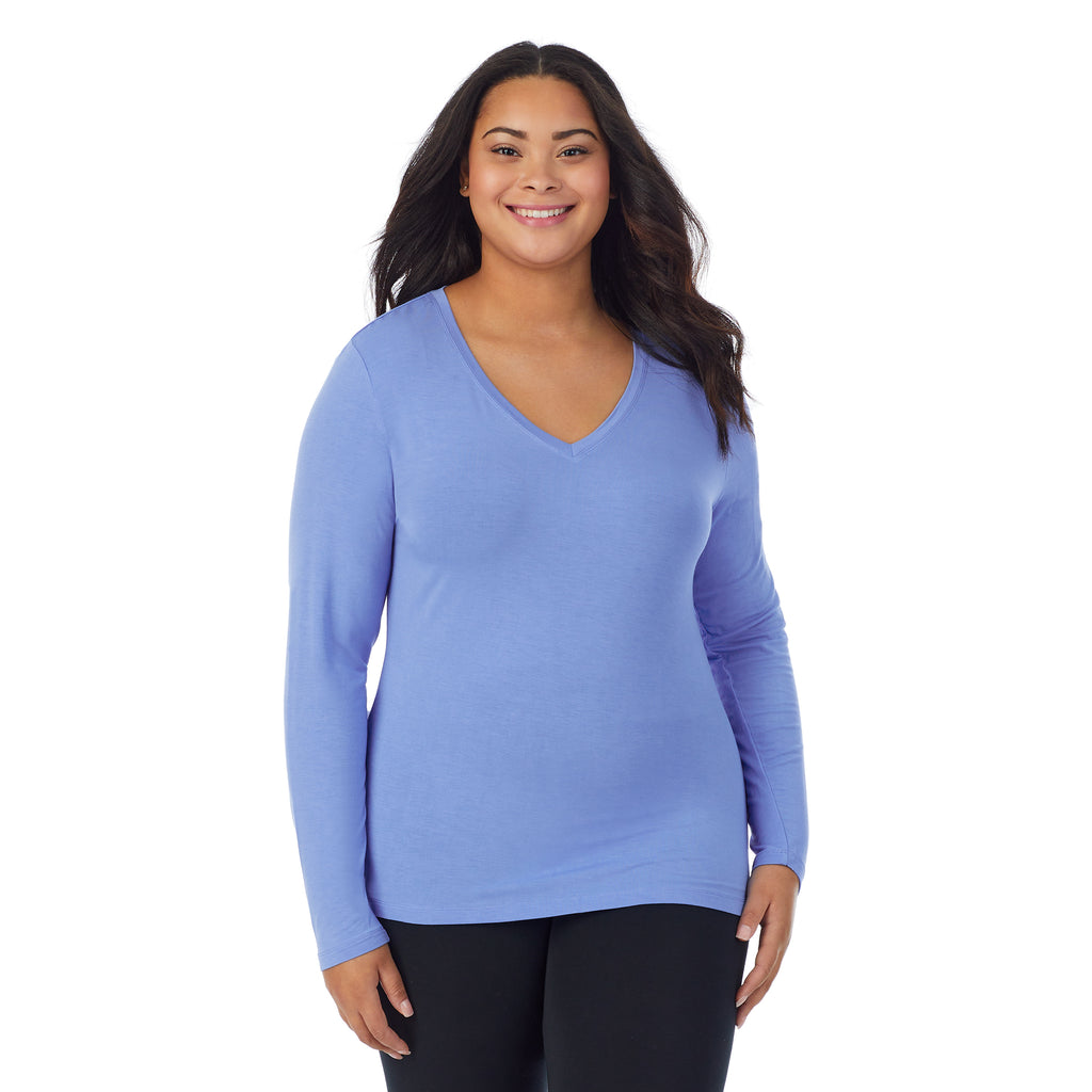 A lady wearing ultramarine long sleeve v-neck plus softwer with stretch top.