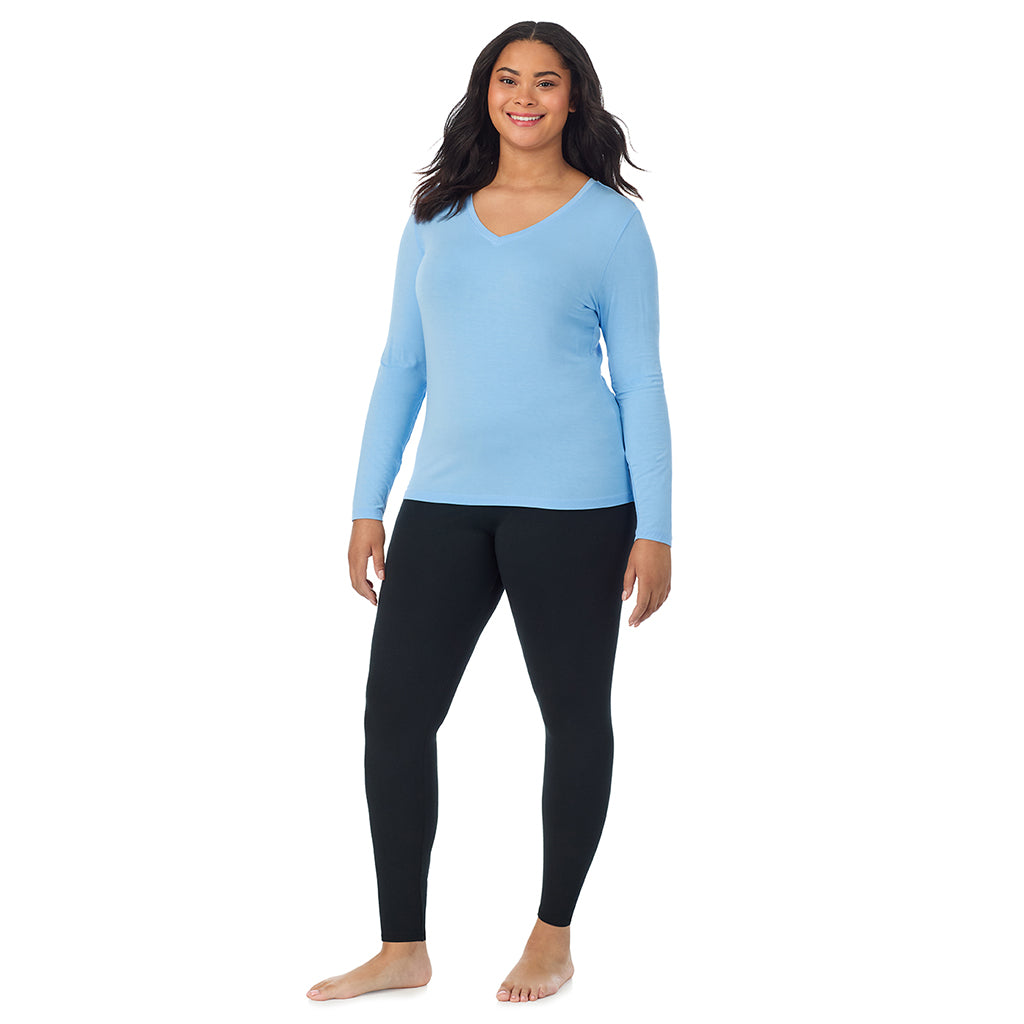 A lady wearing vista blue long sleeve v-neck plus softwer with stretch top.