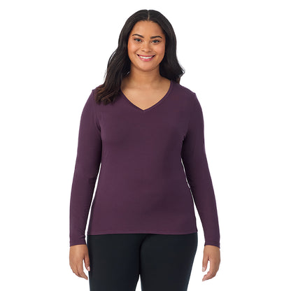 Boysenberry; Model is wearing size 1X. She is 5'11", Bust 36", Waist 36.5", Hips 47.5". @A lady wearing boysenberry long sleeve v-neck plus softwer with stretch top.