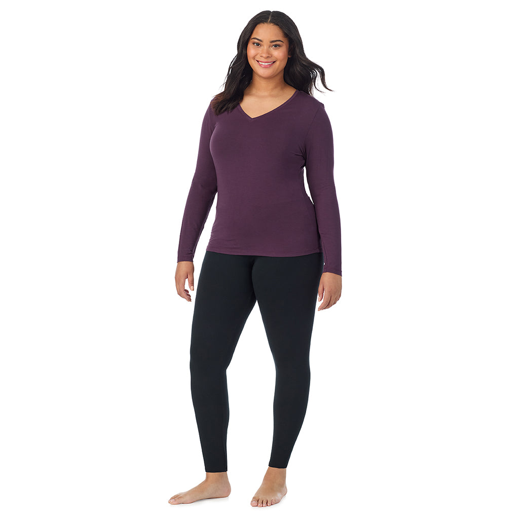 Boysenberry; Model is wearing size 1X. She is 5'11", Bust 36", Waist 36.5", Hips 47.5". @A lady wearing boysenberry long sleeve v-neck plus softwer with stretch top.