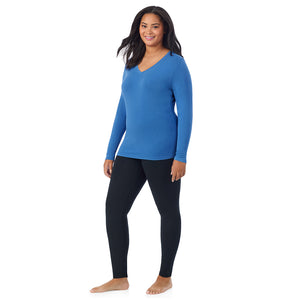 A lady wearing blue comet long sleeve v-neck plus softwer with stretch top.