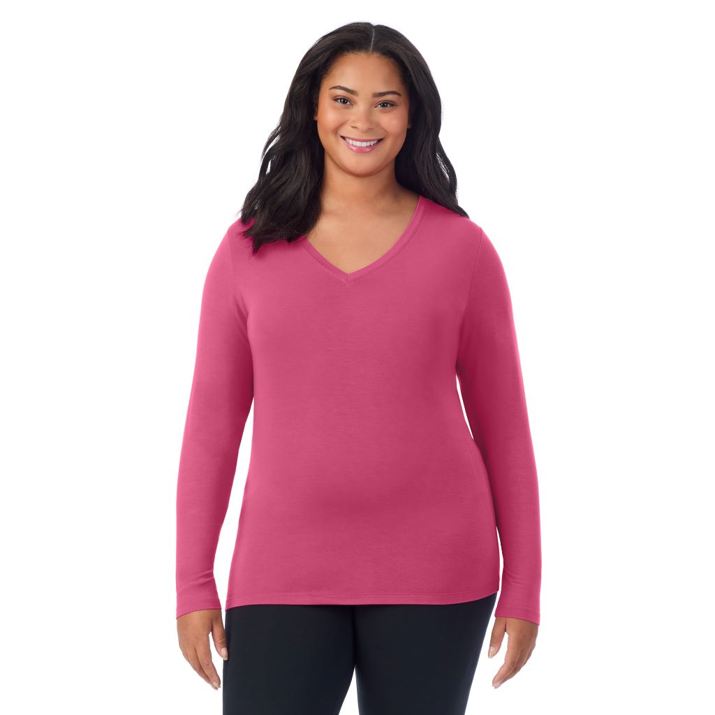 A lady wearing very berry long sleeve v-neck plus softwer with stretch top.