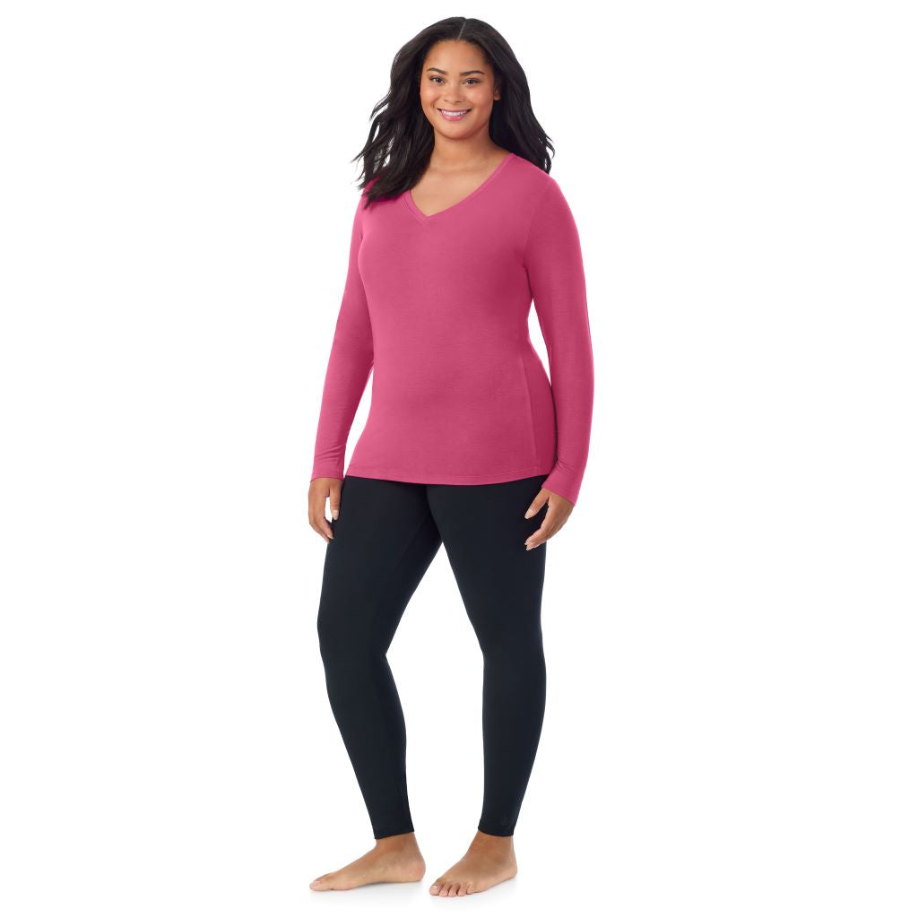 A lady wearing very berry long sleeve v-neck plus softwer with stretch top.