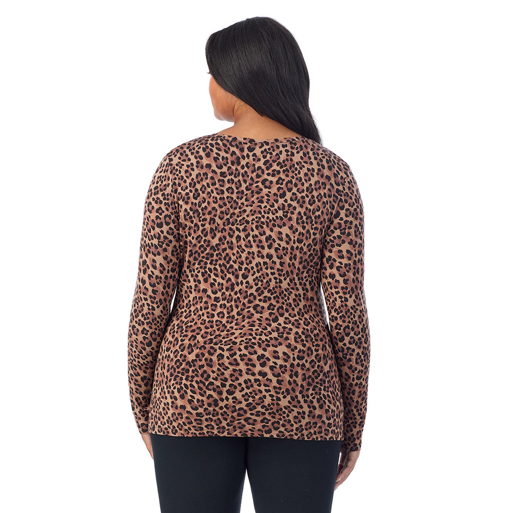 A lady wearing taupe leopard long sleeve v-neck plus softwer with stretch top.
