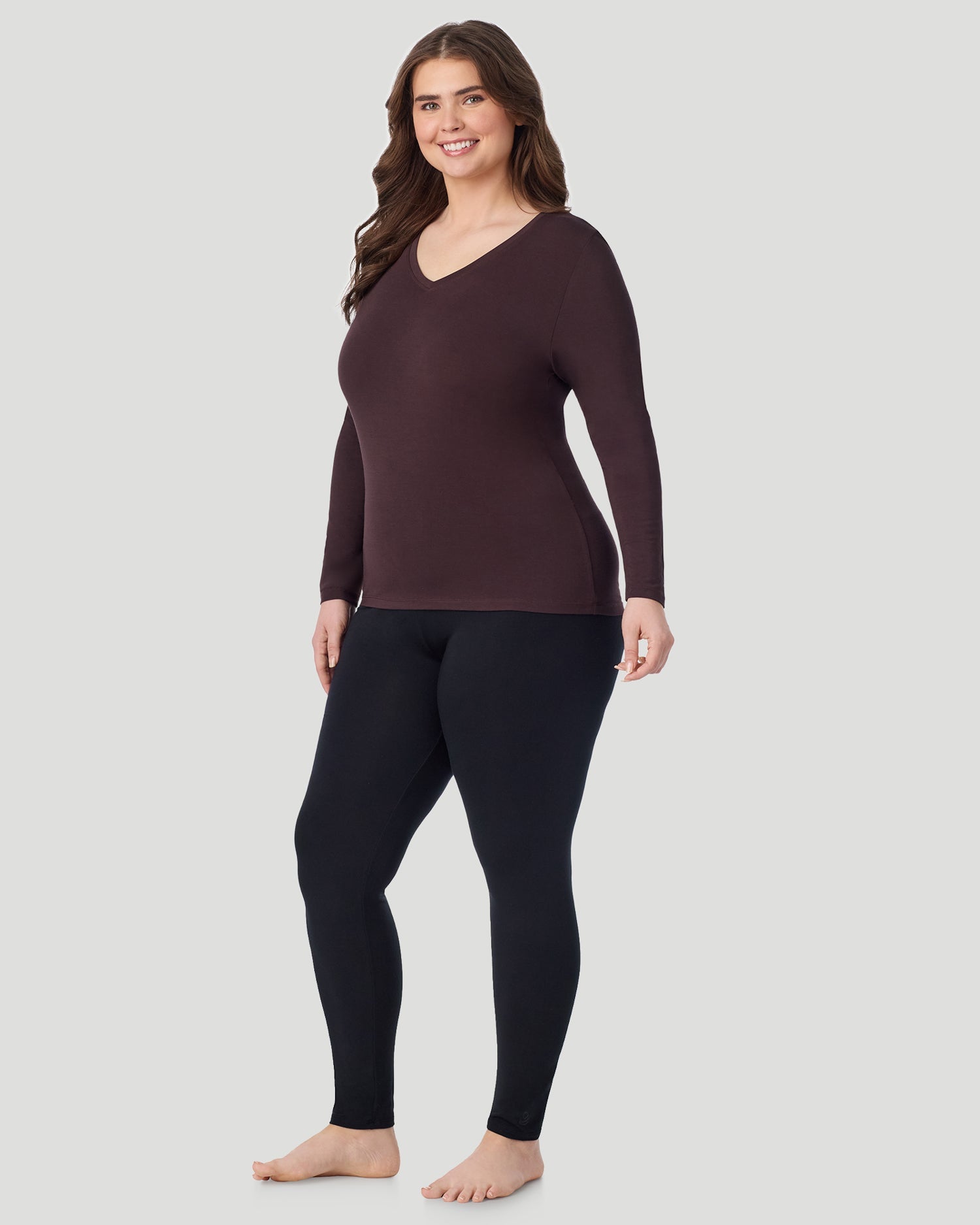  A Plus size lady wearing Mahogany Softwear With Stretch Long Sleeve V-Neck PLUS in a front view standing pose