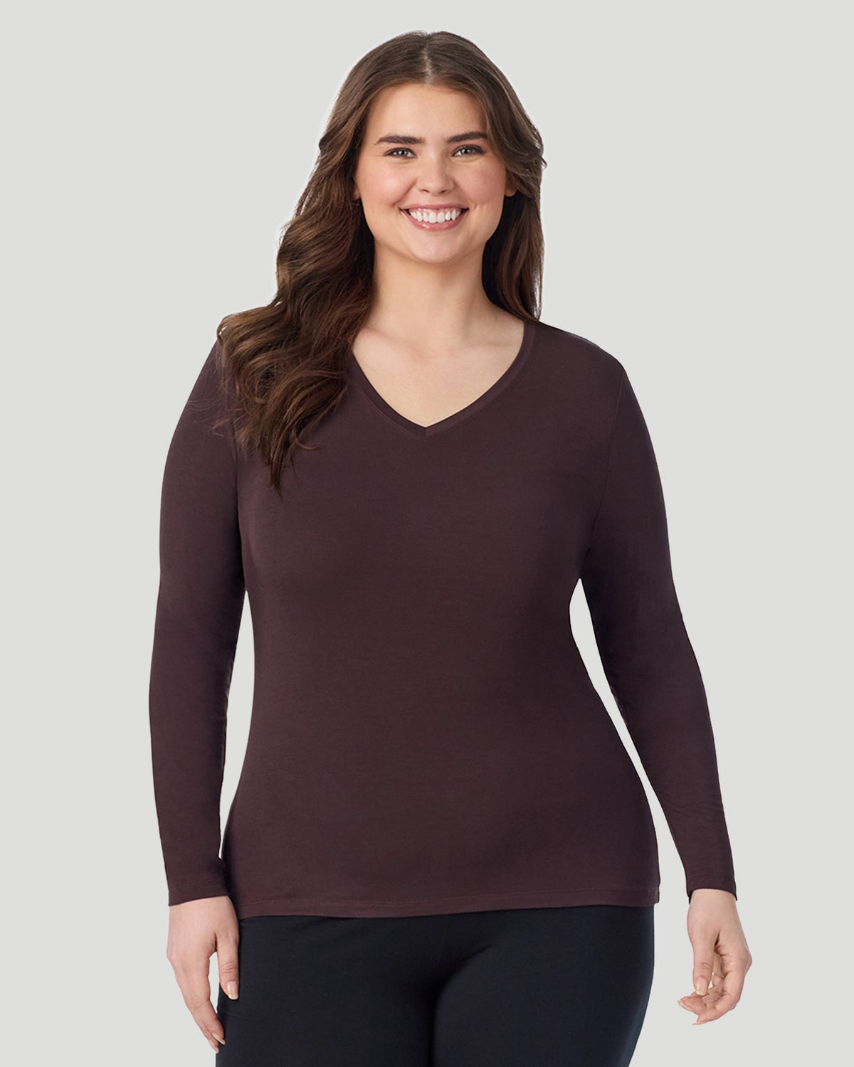 Mahogany; Model is wearing size 1X. She is 5'10", Bust 44", Waist 36", Hips 49". @ A Plus size lady wearing Mahogany Softwear With Stretch Long Sleeve V-Neck PLUS in a front view pose