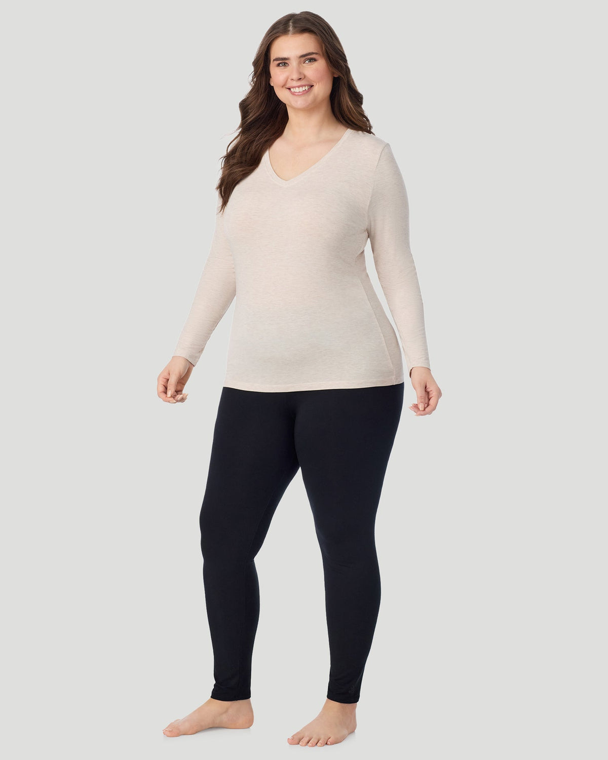  A Plus size lady wearing Oatmeal Heather Softwear With Stretch Long Sleeve V-Neck PLUS in a front view standing pose