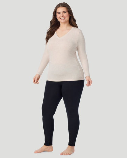  A Plus size lady wearing Oatmeal Heather Softwear With Stretch Long Sleeve V-Neck PLUS in a front view standing pose