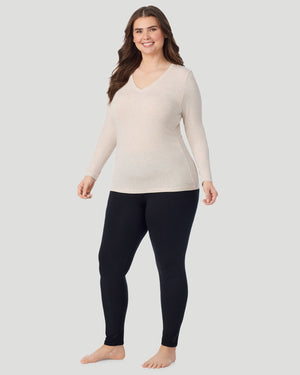  A Plus size lady wearing Oatmeal Heather Softwear With Stretch Long Sleeve V-Neck PLUS in a front view standing pose