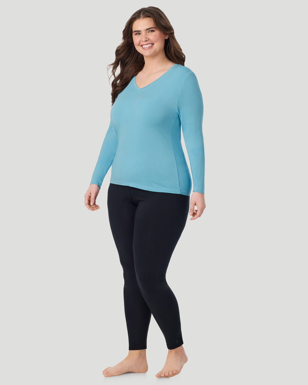 A Plus size lady wearing Cadet Blue Softwear With Stretch Long Sleeve V-Neck PLUS in a front view standing pose