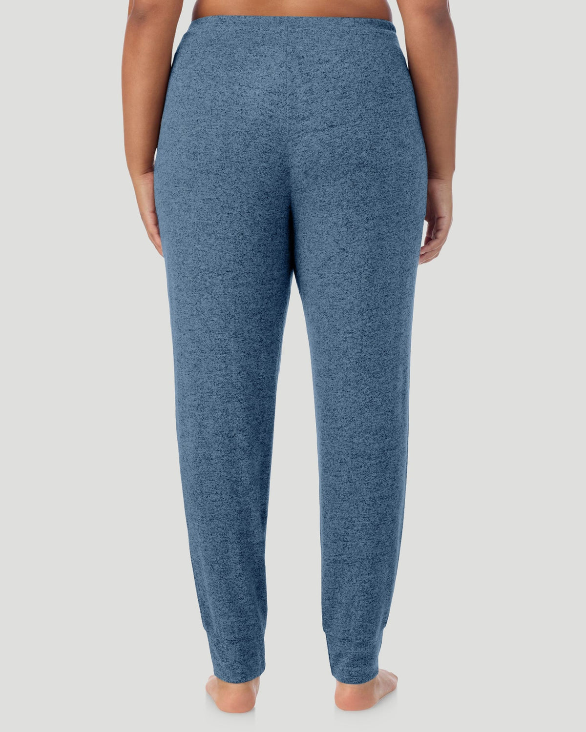 Deep Chambray; Model is wearing size S. She is 5'11", Bust 33", Waist 24", Hips 34". @A lady wearing a Deep Chambray SoftKnit Jogger PLUS in a back view look