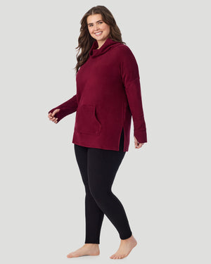 A plus size lady wearing Bordeaux Fleecewear With Stretch Long Sleeve Tunic PLUS in a side angle pose