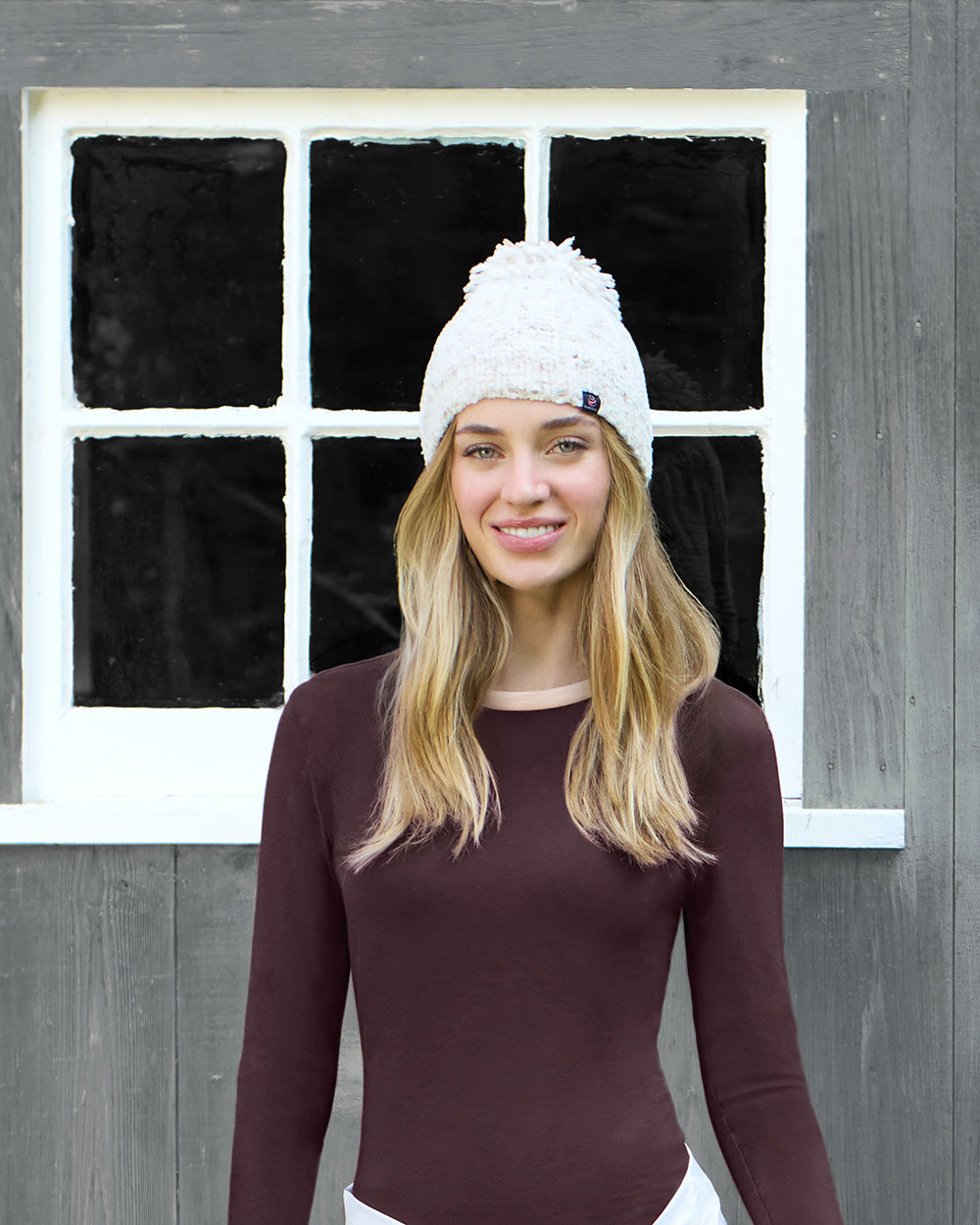 Women in a beanie and fleece layers