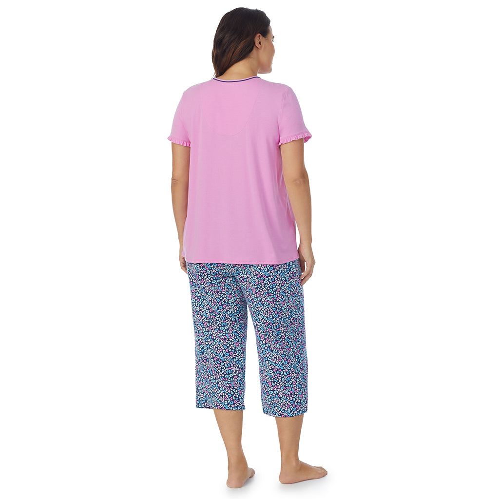 Multi Animal;Model is wearing size 1X. She is 5'11.5", Bust 41", Waist 33", Hips 46"@A lady wearing short sleeve top with cropped pant pajama set with multi animal print