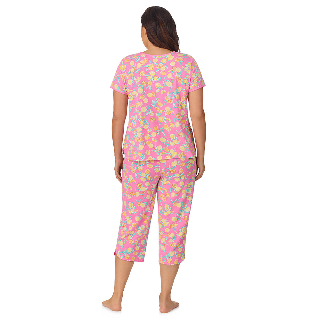 Lemon; Model is wearing size 1X. She is 5'11.5", Bust 41", Waist 33", Hips 46" @A lady wearing pink short sleeve top with cropped pant pajama set with lemon print