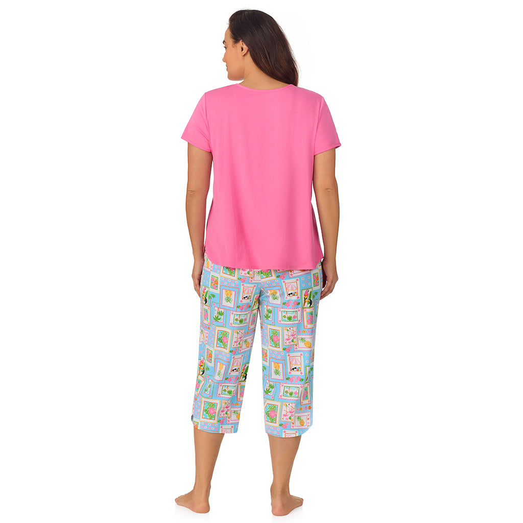 Summer Frame; Model is wearing size 1X. She is 5'11.5", Bust 41", Waist 33", Hips 46" @A lady wearing pink short sleeve top with cropped pant pajama set with summer frame print