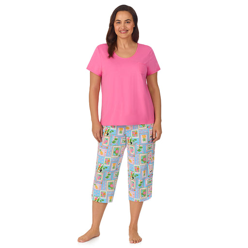A lady wearing pink short sleeve top with cropped pant pajama set with summer frame print
