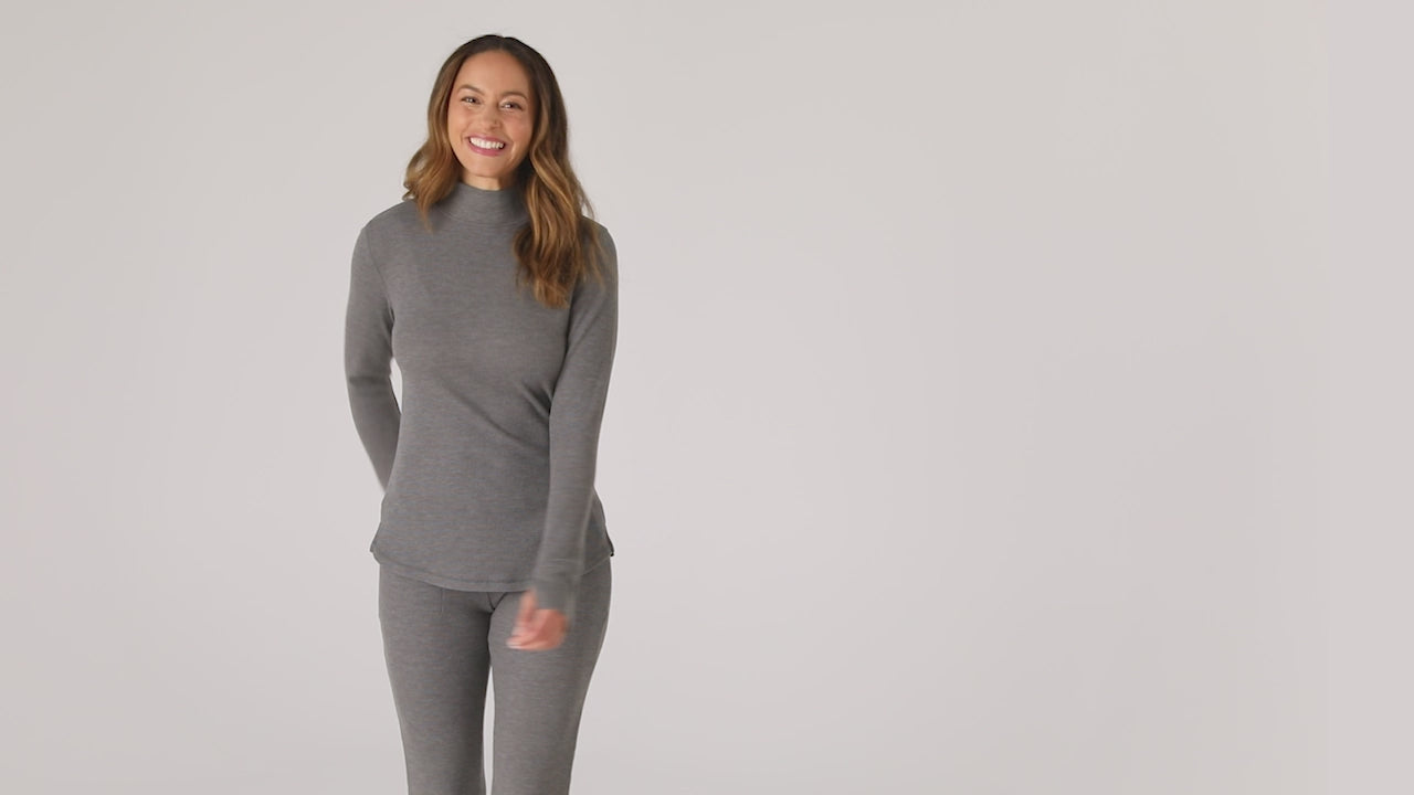  A lady is wearing a Cozy Stretch Thermal Long Sleeve Mock Neck