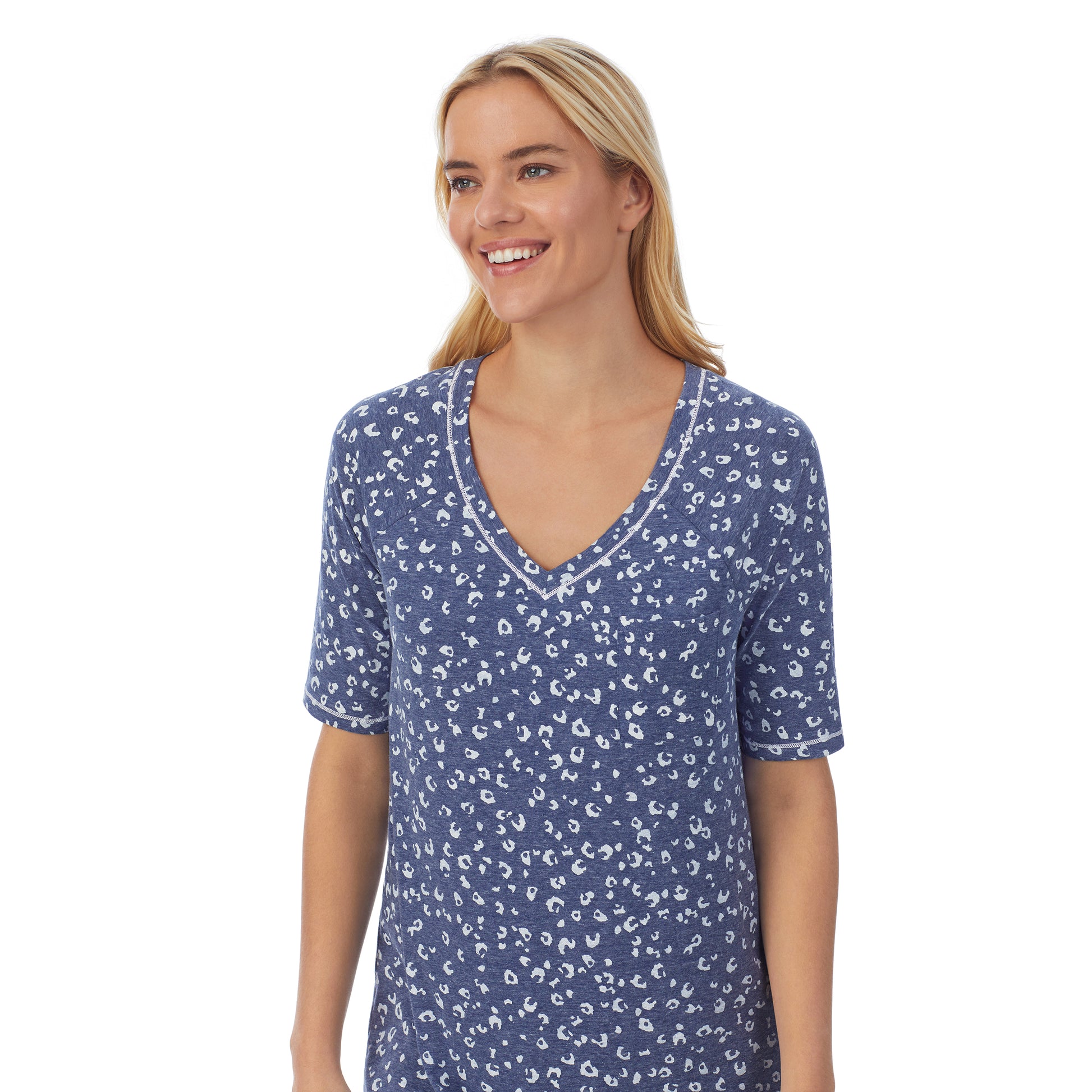 Navy Animal; Model is wearing size S. She is 5'9", Bust 34", Waist 26", Hips 36".@ A lady wearingCuddl Smart Elbow Sleeve Sleep Tee with Navy Animal print