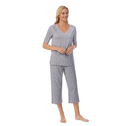 Heather Hearts;Model is wearing size S. She is 5'9", Bust 34", Waist 26", Hips 36".@ A lady wearingCuddl Smart Elbow Sleeve Top with Cropped Pant Pajama Set with Heather Hearts print