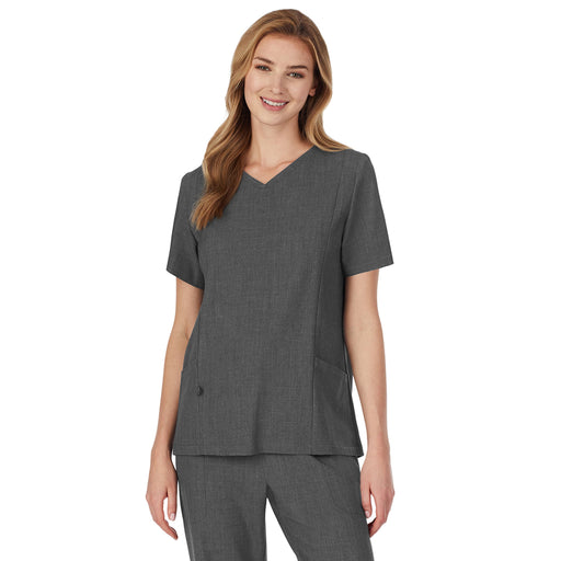 A lady wearing charcoal heather scrub v-neck top with side pockets petite.