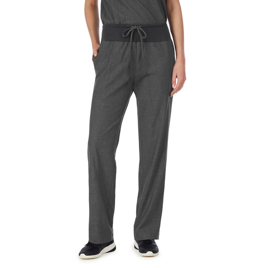 A lady wearing charcoal heather scrub classic pant petite.