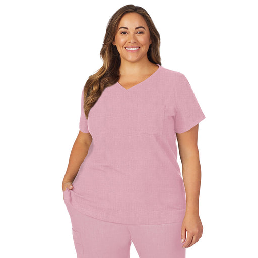 Cameo Pink Heather;Model is wearing size 1X. She is 5’9.5”, Bust 43”, Waist 37”, Hips 49.5”.@A lady wearing pink cameo heather scrub v-neck top with chest pocket plus.