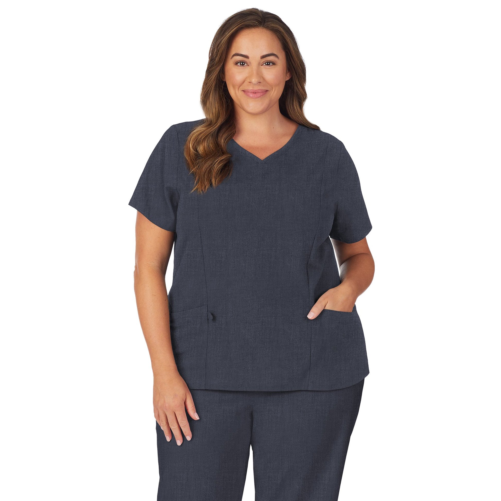 Navy Heather;Model is wearing size 1X. She is 5’9.5”, Bust 43”, Waist 37”, Hips 49.5”.@A lady wearing navy heather scrub v-neck top with side pockets plus.