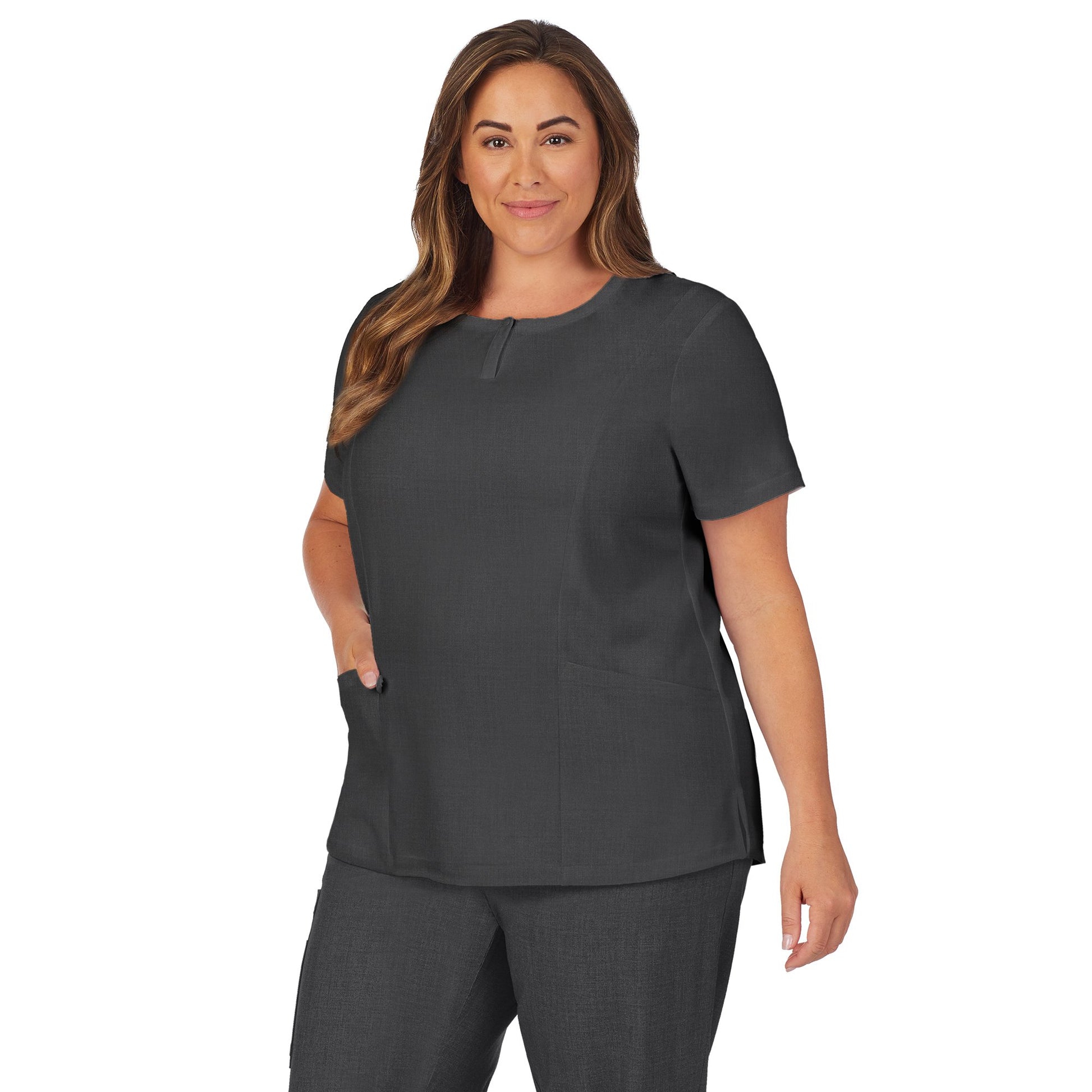 Charcoal Heather;Model is wearing size 1X. She is 5’9.5”, Bust 43”, Waist 37”, Hips 49.5”.@A lady wearing charcoal heather scrub henley neck top with side pockets plus.
